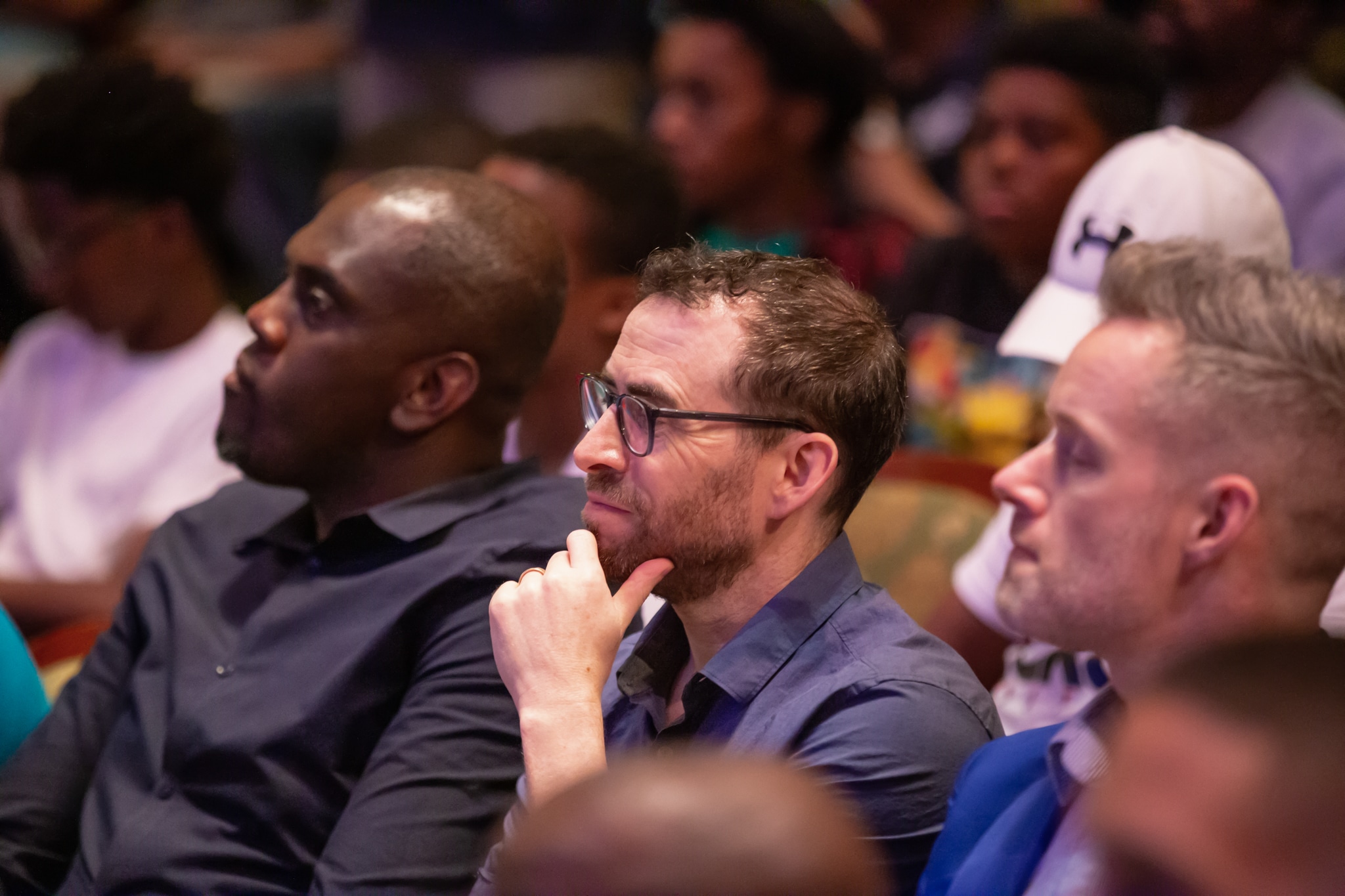 Men listening to a lecture