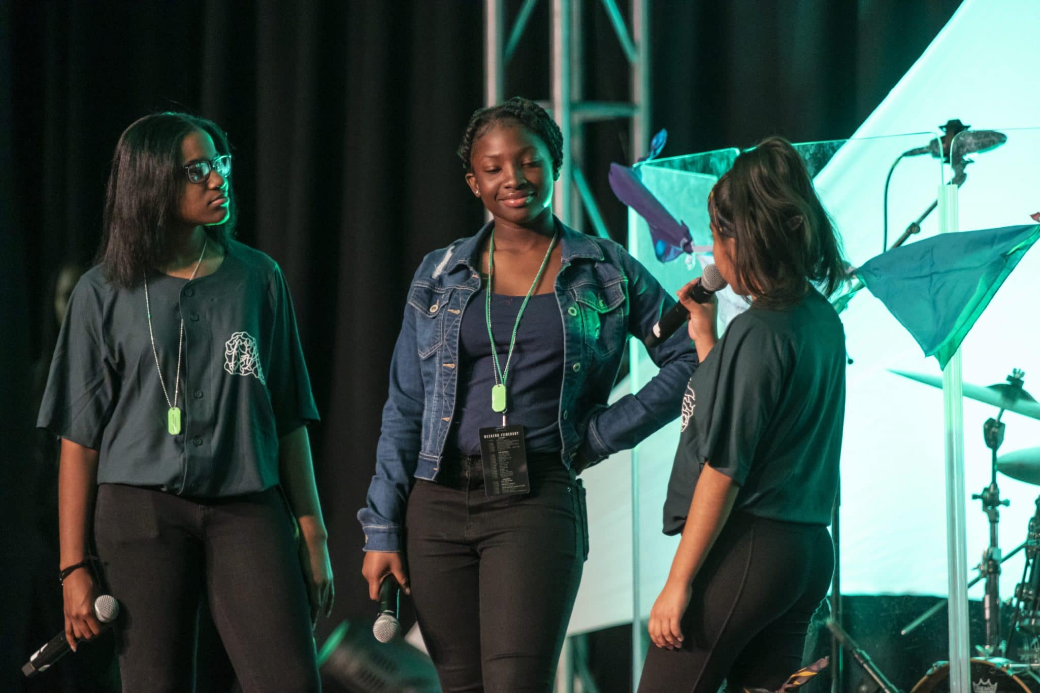 three girls on stage