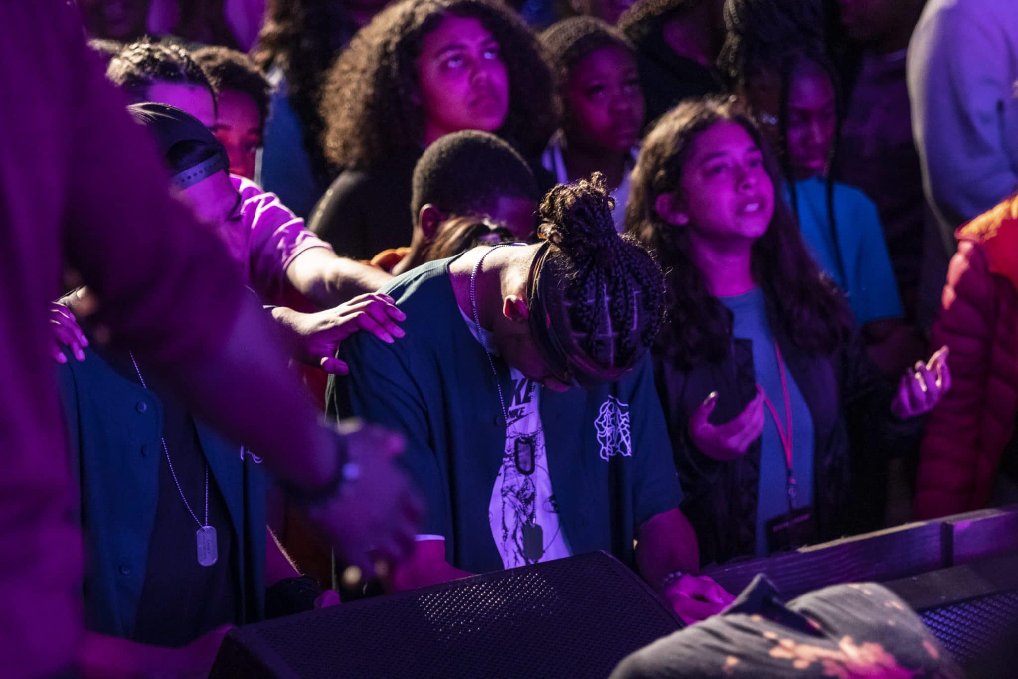 group of teens praising