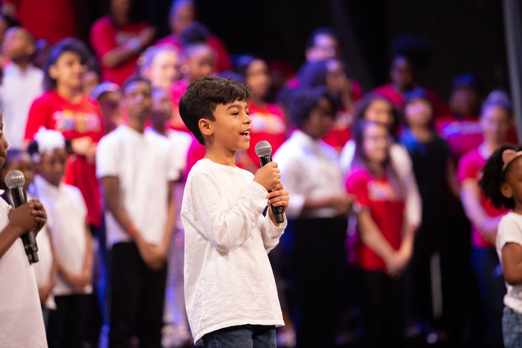 kid talking into microphone