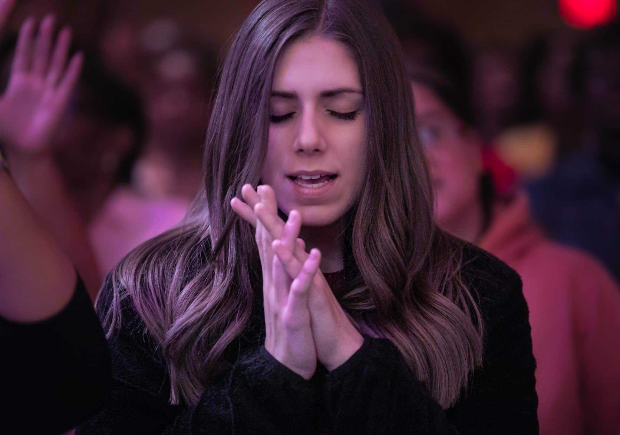 woman in black praying