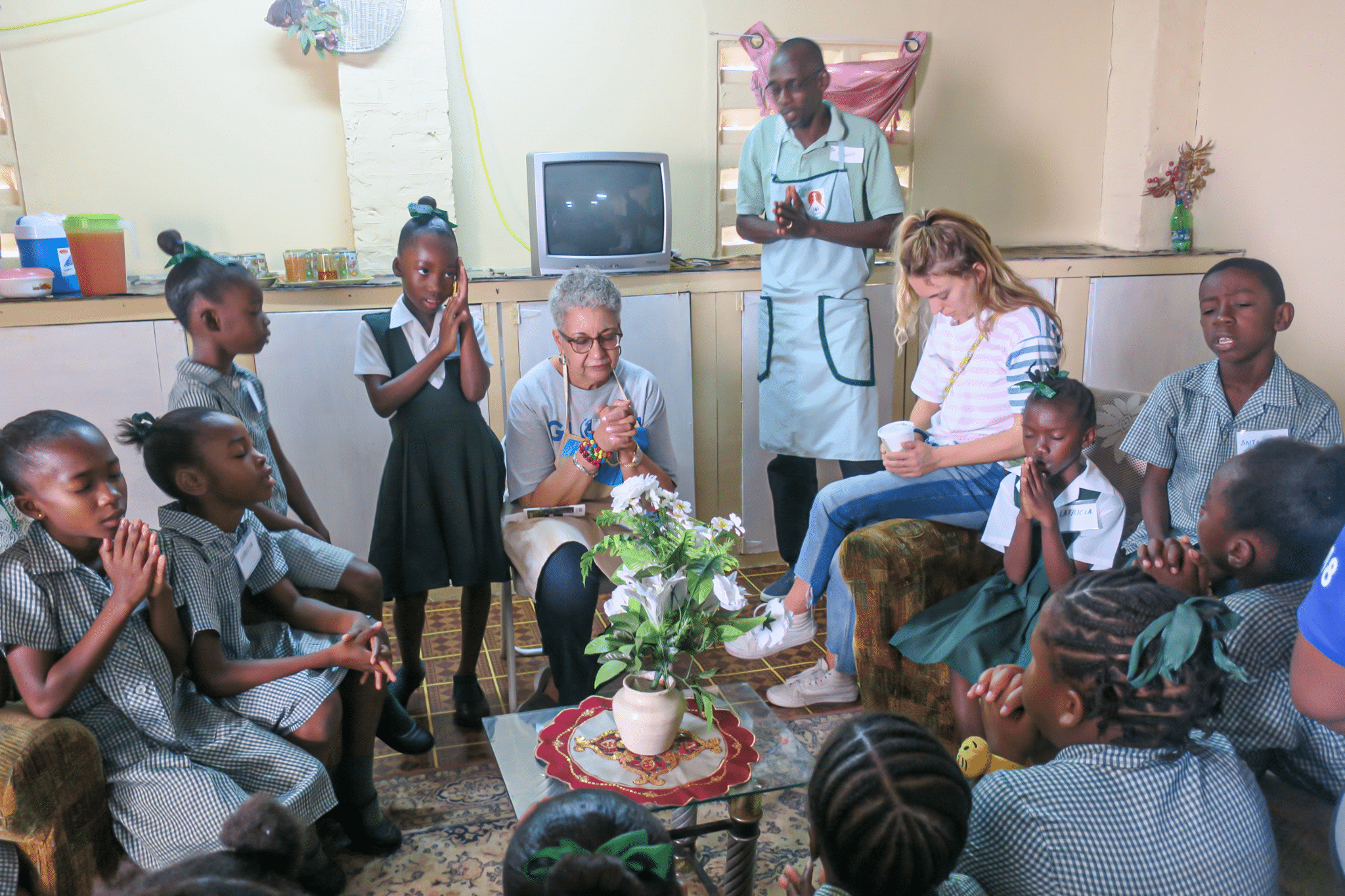 vase on the table centre, children praying