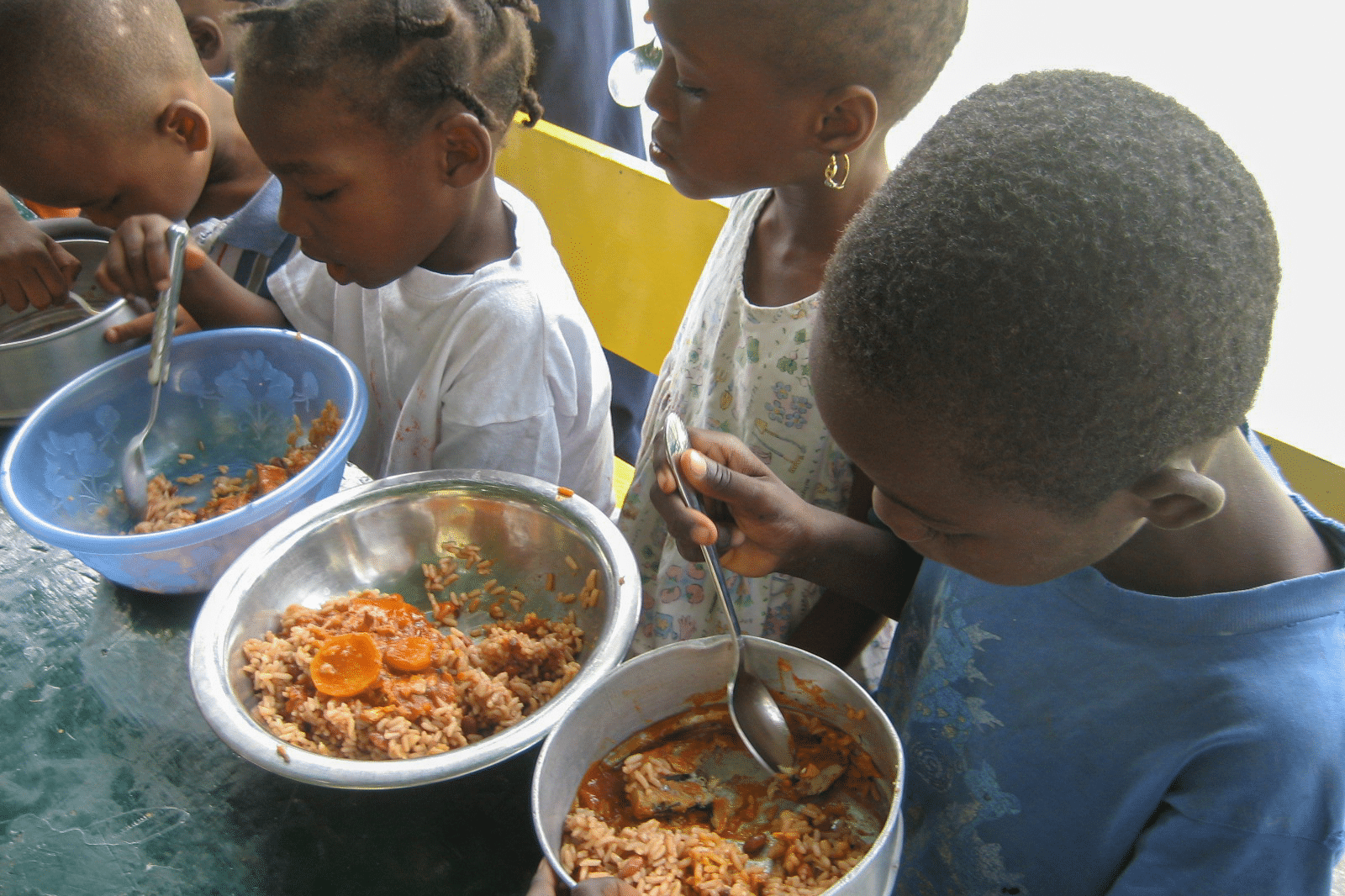 children eating - food feeding program in Haiti