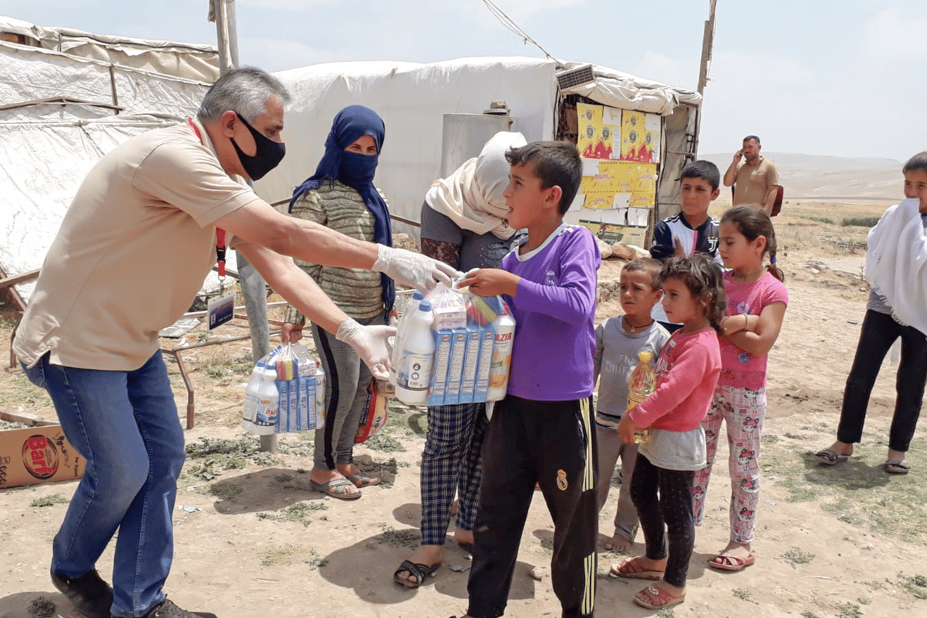 Man gives cleaning kits to children