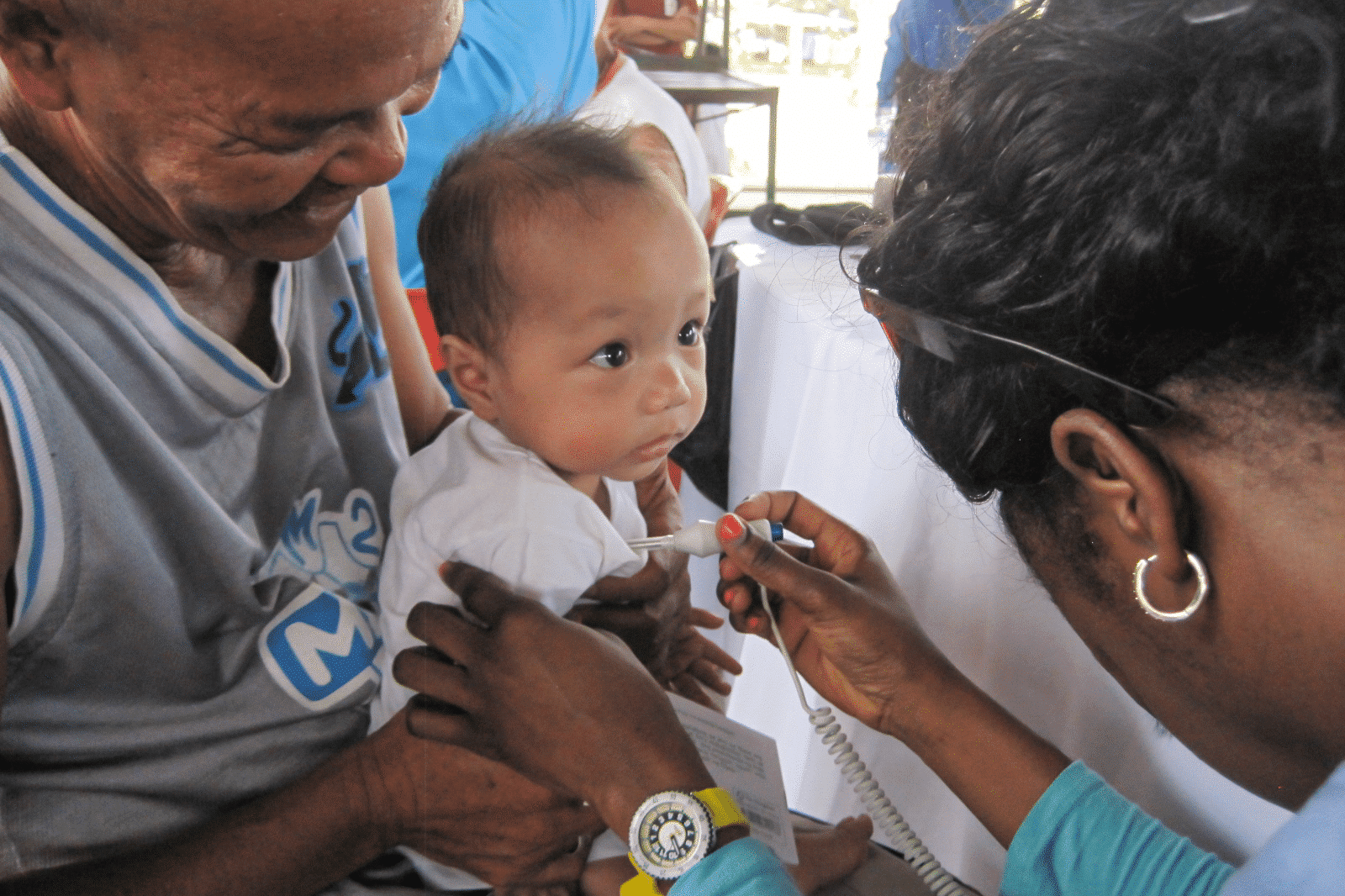 Nurse checking the baby's temperature