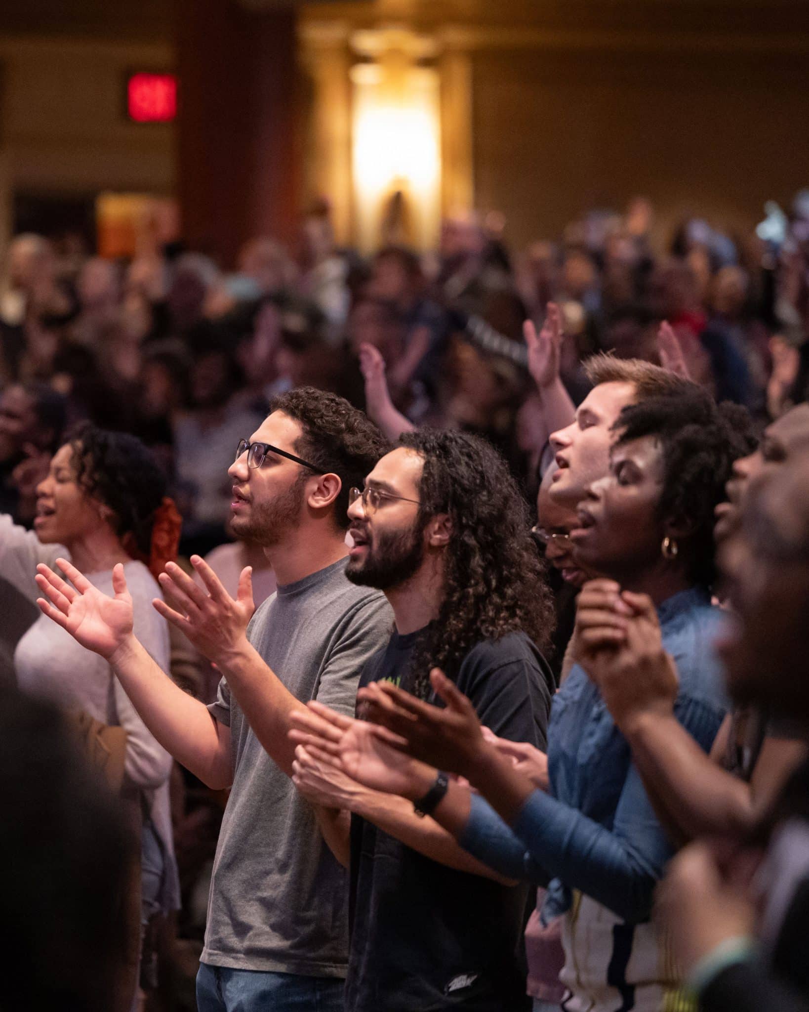 People raising their hands in praise to God