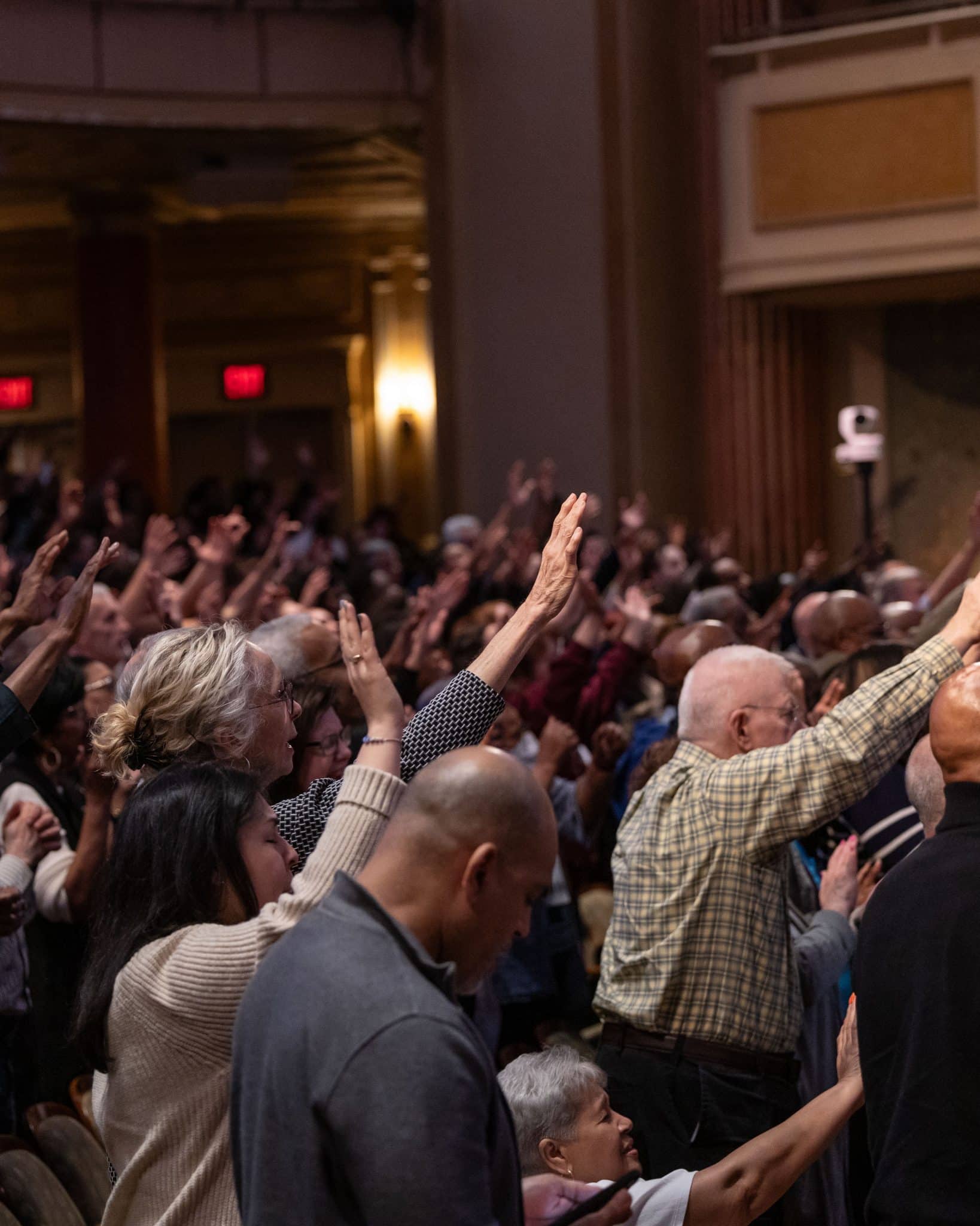 People praising and praying at the Brooklyn Tabernacle