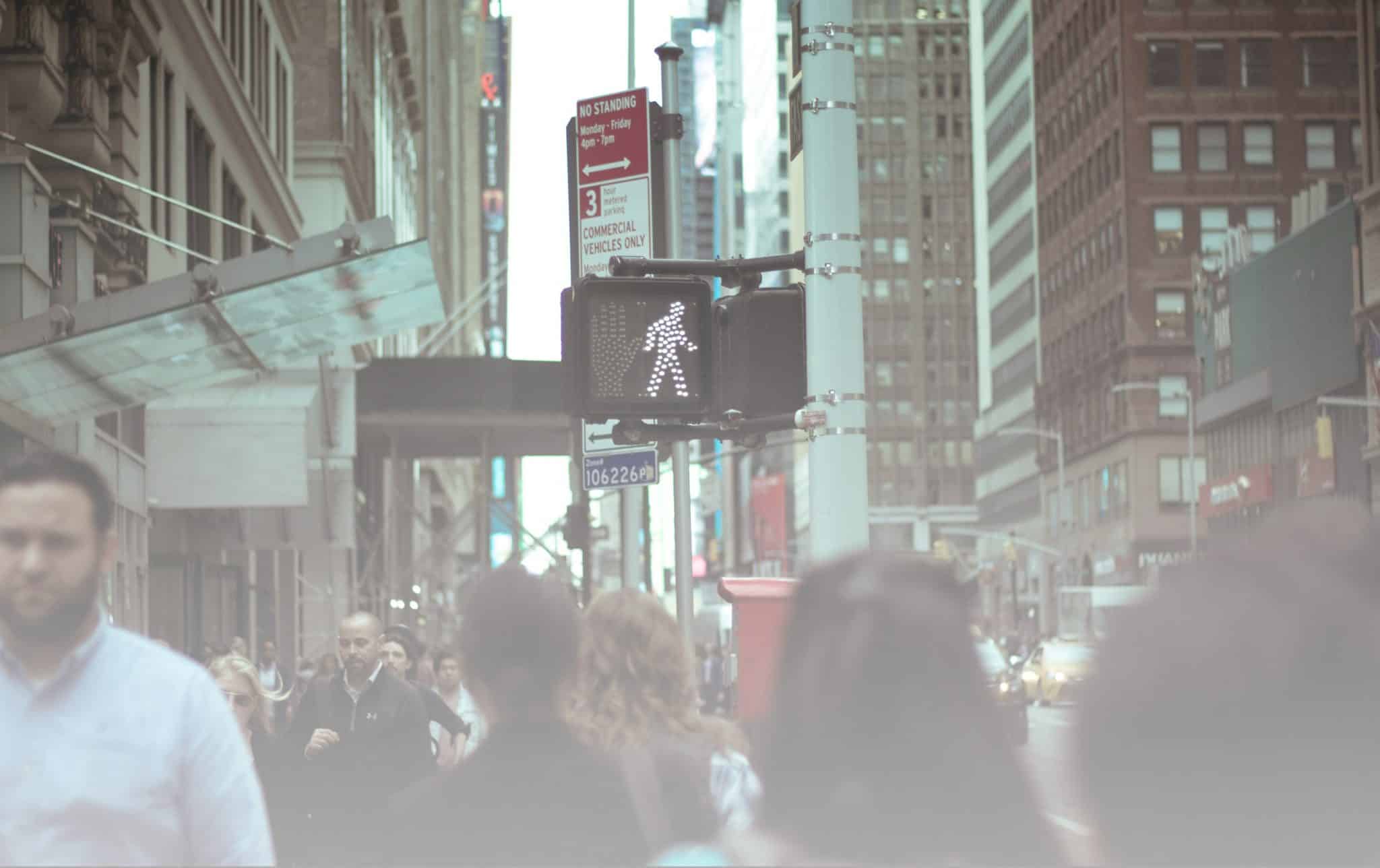 Pedestrians crossing a busy street in New York City